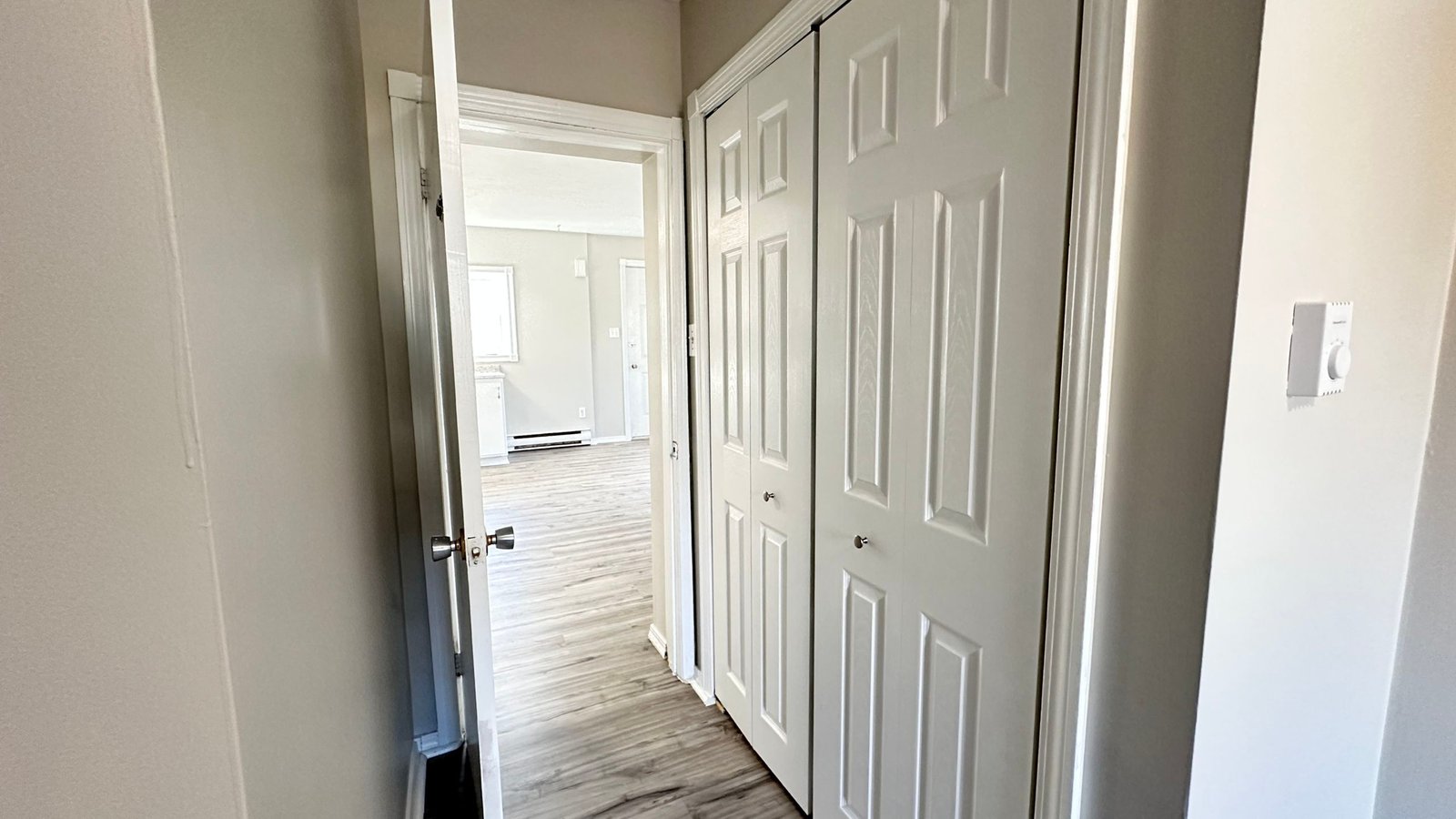 a hallway with white doors