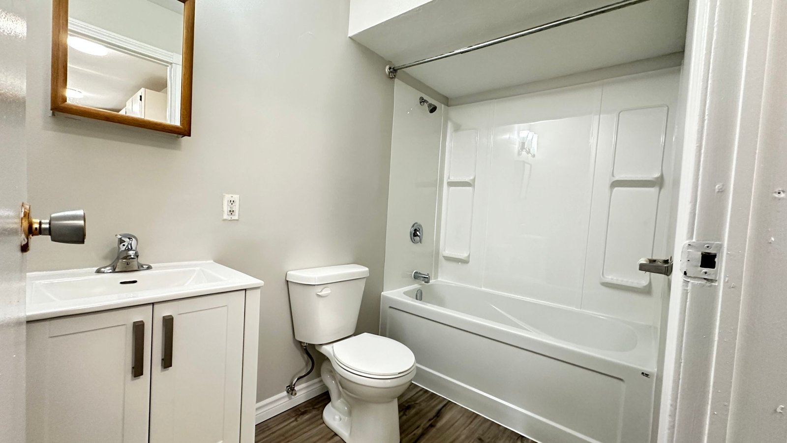 a bathroom with a toilet and bathtub